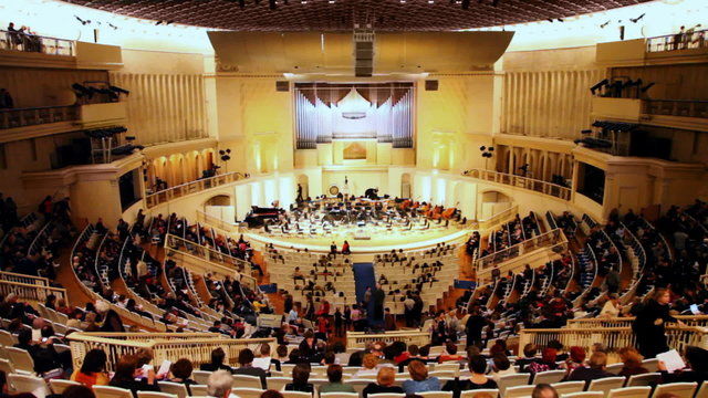 people waiting for concert in hall