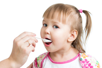 doctor giving drug to child girl isolated on white