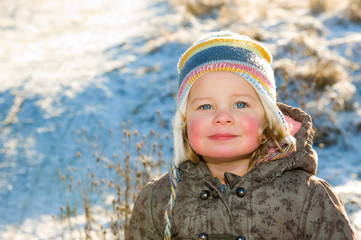 child in front of winter- background
