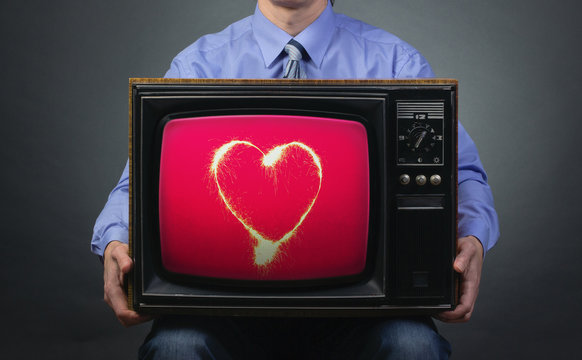 Retro TV Featuring Sparkling Heart In The Hands Of Men.