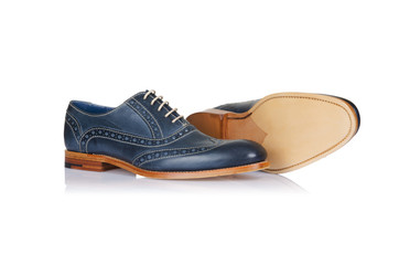 Fashion concept with male shoes on white