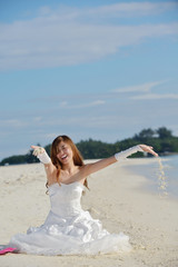 Fototapeta na wymiar asian bride on beach