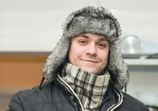 man in a cap with earflaps