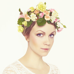 Beautiful young girl with flowers