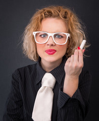 Serious professor woman holding chalk is ready for writing