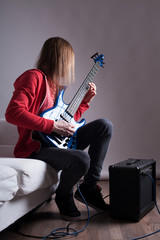 Fototapeta premium young guitarist playing guitar