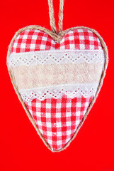 valentine heart with bow against red background