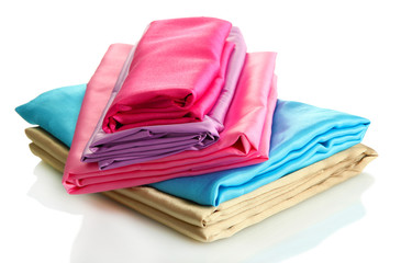 heap of cloth fabrics isolated on white
