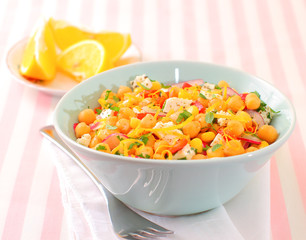 Chickpeas salad with fresh vegetables and cheese
