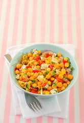 Chickpeas salad with fresh vegetables and cheese