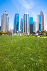 Naklejka premium city park with modern building background in shanghai