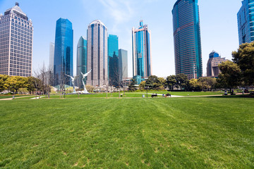Obraz premium city park with modern building background in shanghai