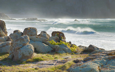 Rocls, lichens ans stormy sea in Galicia Spain.