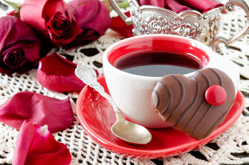 coffee with flowers and heart-shaped cookie