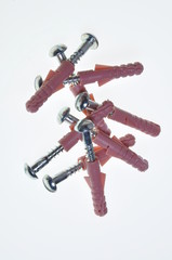 Group of pink dowels and screws