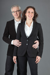 Happy middle aged couple. Man and woman. Studio shot.