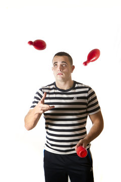 Young man juggling