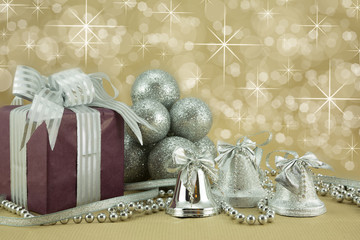 Gift with silver bells and glitter baubles.