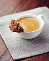 Cup of cafe crema with chocolate chip cookie