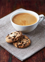 Cup of cafe crema with chocolate chip cookies