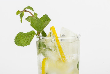 Healthy club soda with lemon and mint on white background
