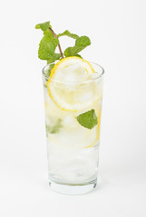 Healthy club soda with lemon and mint on white background