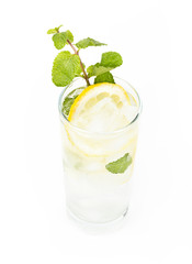Healthy club soda with lemon and mint on white background