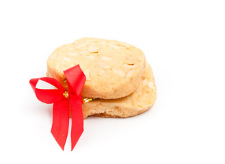 cookies macadamia nut and red ribbon on the white background