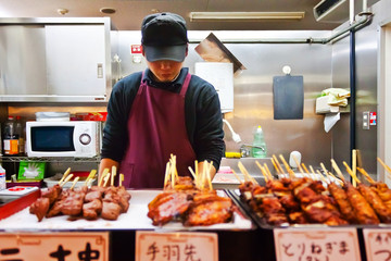 Naklejka premium Japanese barbecue shopkeeper