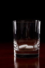 pills in a glass