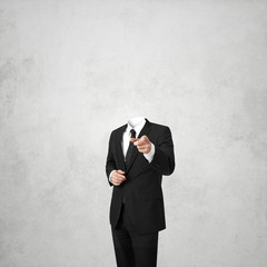 business man without a head on white concrete background