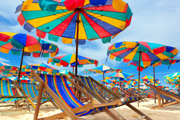 Beach chair and umbrellas on the beach