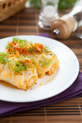 cabbage rolls with rice and mushrooms on a plate