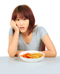 Isolated young asian woman with a plate of potato chips and fren