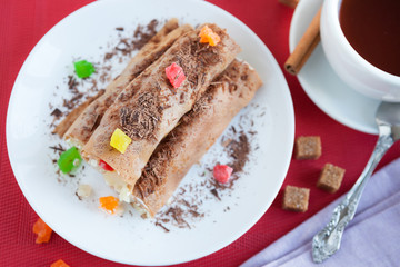 pancakes with pineapple stuffing and grated chocolate