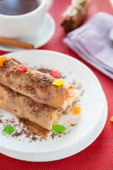 pancakes with pineapple filling and grated chocolate