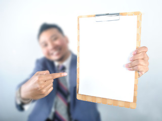 Business man showing note pad