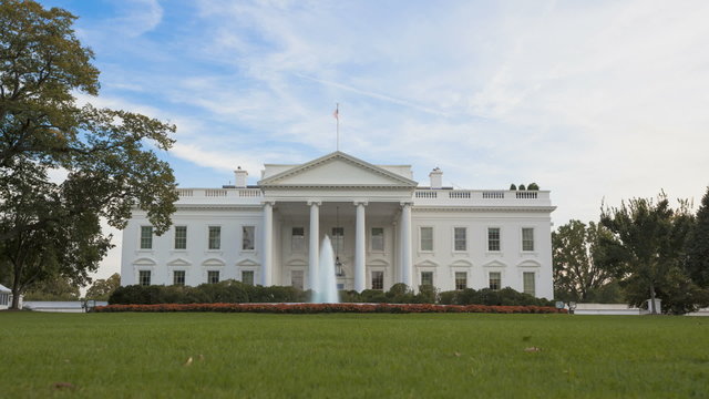 Time lapse of the White House with a blue sky