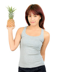 Isolated young asian woman with pineapple