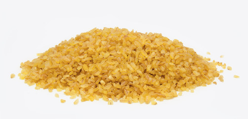 Heap of  bulgur wheat groats isolated