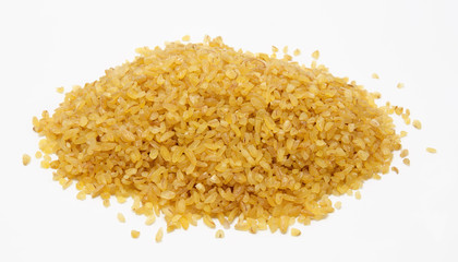 Heap of  bulgur wheat groats isolated