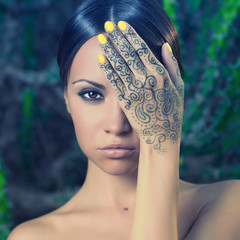 Lady with painted hands mehendi