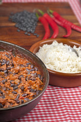 Chili con carne with rice, black beans and red peppers