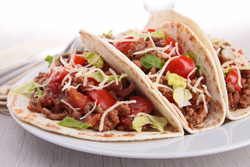 beef tacos with salad and tomato