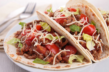beef tacos with salad and tomato
