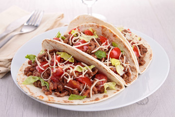 beef tacos with salad and tomato