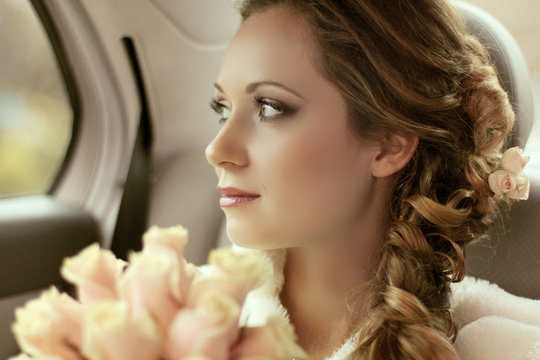 Beautiful bride woman portrait with bridal bouquet posing in her
