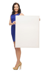 lovely woman in blue dress with blank board