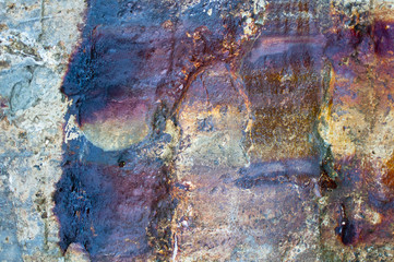 Grungy concrete wall with strong rust stains.