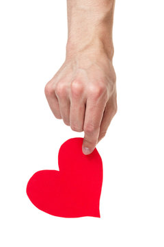 adult male hand holding paper heart